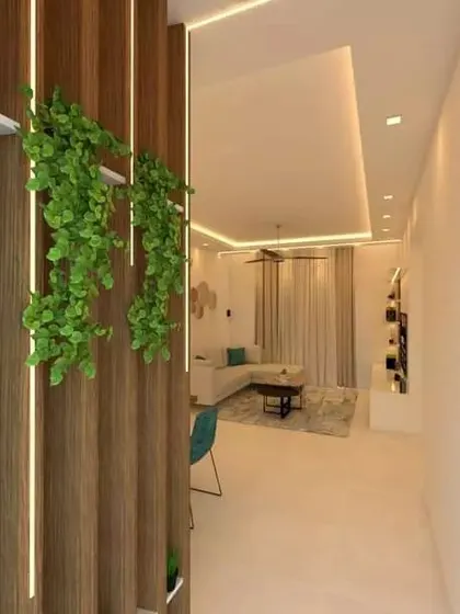 Another angle of the entryway partition at United Blossoms, showing how it effectively screens the living area while adding a touch of green.