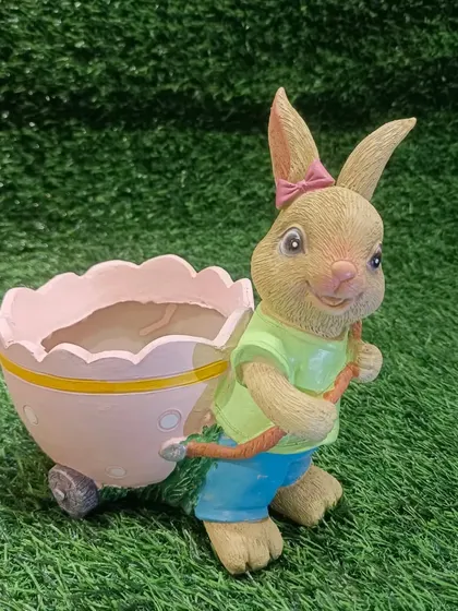 Our rabbit planter, shown here in a lovely pink, is perfect for small indoor plants or succulents. It adds a touch of whimsy to your home garden.