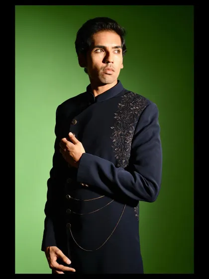 The angrakha style cut of this Indo western jacket is a modern interpretation of a classic silhouette. It is tailored to create a flattering, slim profile while allowing for comfortable movement.