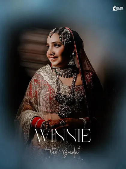 An ethereal portrait of bride Winnie, framed by a soft blue vignette that enhances her bridal glow.