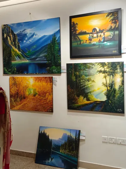A shot from a group exhibition at our gallery, showcasing a diverse collection of landscape paintings by various Indian artists. We regularly host events to bring fresh and exciting art to the city.