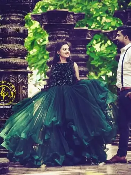 The couple's outfits were chosen to create a beautiful contrast with the stone pillars of the photoshoot location. I offer consultations to help select the best attire for your chosen theme.
