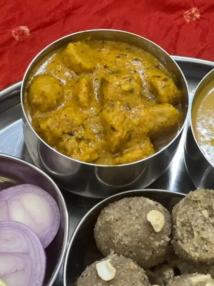 A close-up of the rich and flavorful Masala Gatta curry, a staple in our Rajasthani menu.