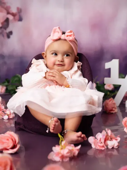 A sweet and shy smile from this 6-month-old princess during her half-birthday photoshoot.