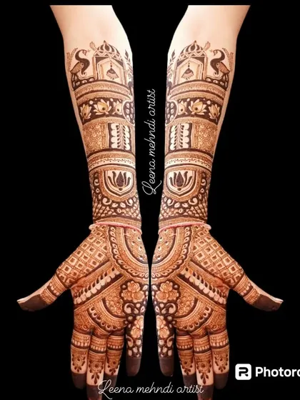 This full-arm design is perfect for the bride's family. It features traditional elements like peacocks, lotuses, and architectural domes, creating a rich and complete look.