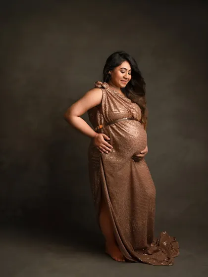 For the mama who loves a bit of sparkle. This sequined gown catches the light beautifully, adding a touch of glamour to your pregnancy portraits.
