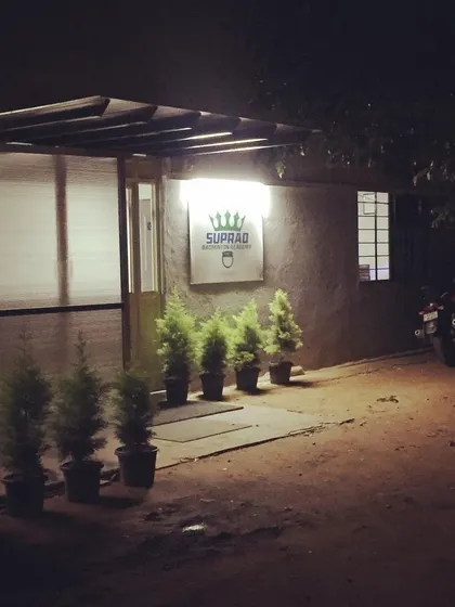 The entrance to Suprad Badminton Academy at night. My facility is open until 11:00 PM, making it a great option for after-work corporate sports activities.