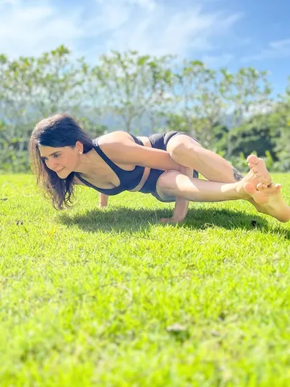 The grass is greener where you water it. Practicing an arm balance in the lush grass of Phuket, I'm reminded that our happiness and success are what we choose to cultivate every day.