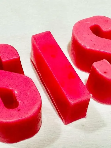 Our personalized 'SIS' letter soaps are a unique way to add a personal touch to your Raksha Bandhan gift. These are handmade with care and come in a vibrant pink color.