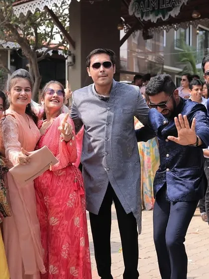 The whole family grooving together in the baraat. These are the candid moments of collective joy that make a wedding so special.