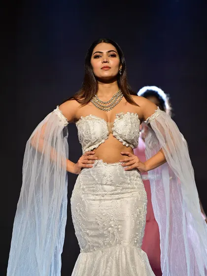 A fierce and powerful runway look in a stunning white lace gown. I created a sharp, defined makeup look with strong contouring and smoky eyes to match the dramatic outfit.