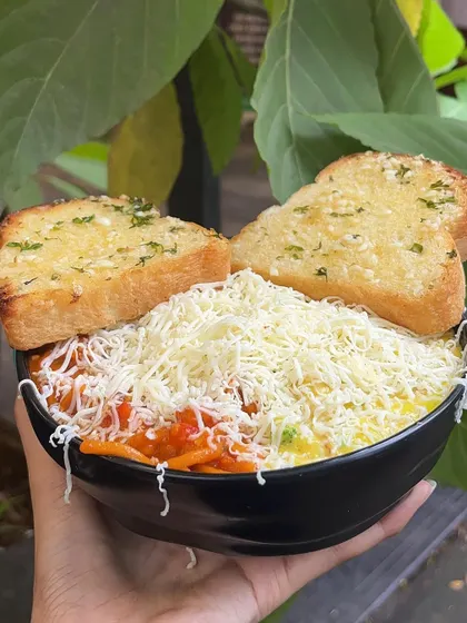 Can't decide between red or white sauce? With my special Pasta & Pasta, you don't have to. I serve both creamy white sauce and tangy red sauce pasta in the same bowl, topped with plenty of cheese and served with garlic bread.