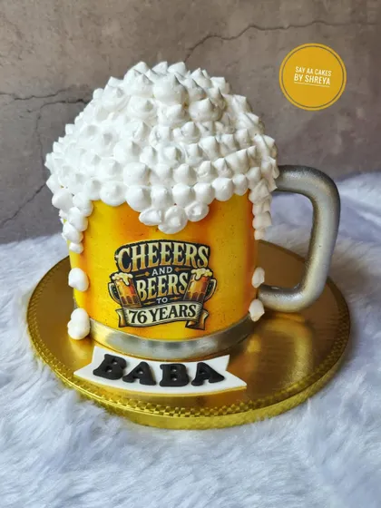 Cheers to 76 years! This 3D beer mug cake is fully sculpted and features an edible print for the label. The overflowing foam on top is made from light, fluffy meringue, making it a fun and realistic cake for any beer lover's birthday.