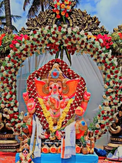 We pour our hearts into Ganesha Chaturthi celebrations. This grand idol setup features a dense, custom-made floral arch with thousands of fresh roses and chrysanthemums, creating a divine centerpiece for the festival.
