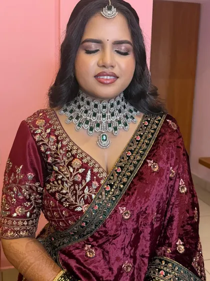 A close-up of Ramya's bold eye makeup. The shimmer and definition make her eyes pop, perfect for a glamorous evening event.