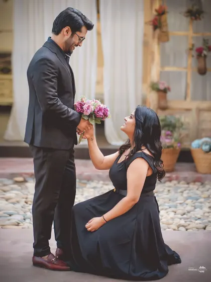 A modern twist on a classic proposal, with her on one knee. This shot is both sweet and empowering, capturing a beautiful, heartfelt moment.