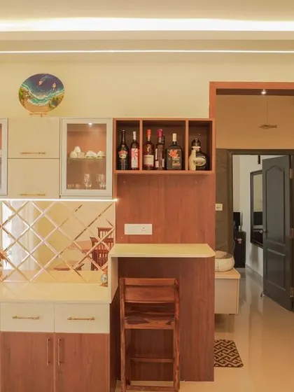 A sophisticated dining and bar unit that combines storage and style. It features glass-front cabinets, a wine rack, a mirrored backsplash, and a tall display cabinet for a complete entertainment solution.