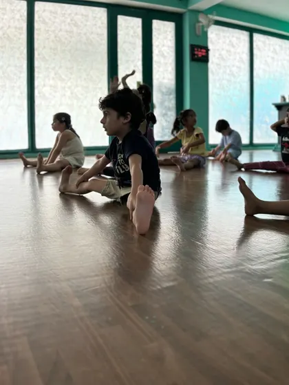 Our beginners class working on foot flexibility. Even the youngest dancers learn the importance of pointed toes.