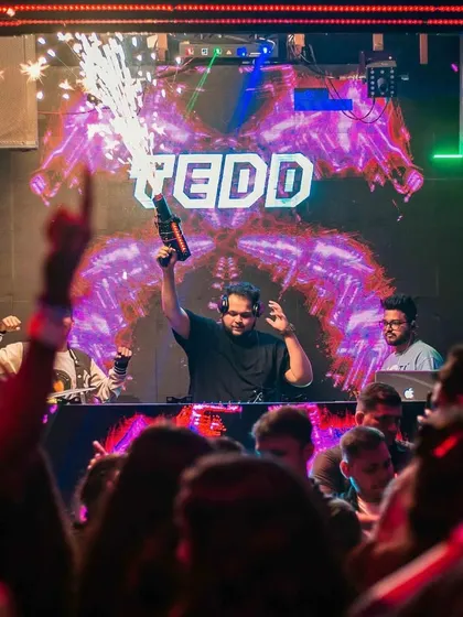 Lighting it up with a pyro gun. I use every tool at my disposal to make sure the energy in the club is always at its maximum.