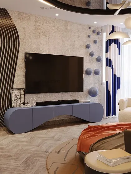 The TV wall in the floating ceiling bedroom features a custom wavy blue console and matching curtains, continuing the fluid, organic theme of the design.