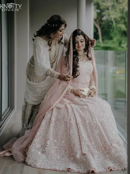 A touching moment between the bride and her mother during the getting-ready process. We capture the emotional connections with family.