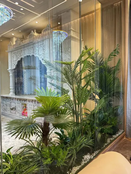 A closer look at the artificial tropical garden we created for the indoor pooja area. The variety of palms and ferns gives it a very realistic and dense jungle-like feel.
