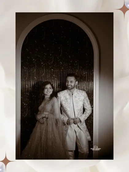 A classic, sepia toned portrait of the couple. The archway frames them perfectly, creating a timeless and elegant engagement photo.