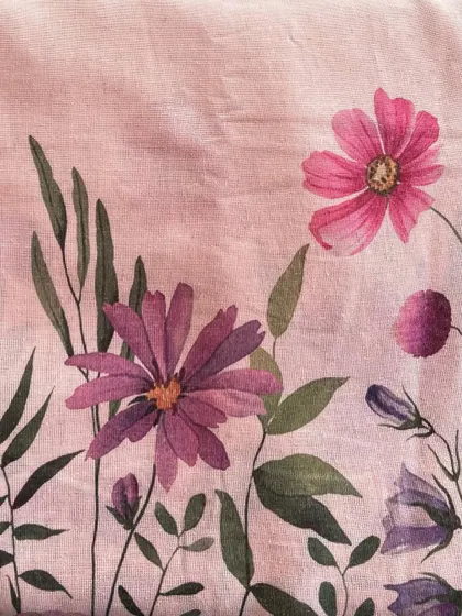 A beautiful Jute Daman printed fabric with a vibrant floral design, combining a unique texture with an artistic print.