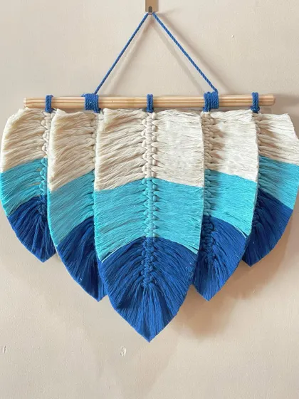 A cool-toned leaf wall hanging featuring dip-dyed effect leaves. The gradient from natural white to shades of blue creates a beautiful, ocean-inspired look.