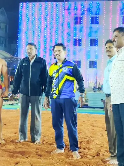 Standing with the organizers and a competitor at the Kusti event.