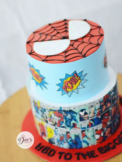 Another angle of the Spider-Man cake, showing the "POW!" and "BOOM!" comic book effects.