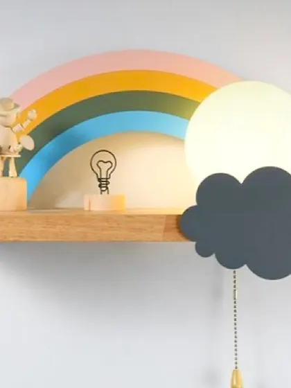 This rainbow shelf doubles as a night light, with a soft glowing moon and a cloud pull-chain. It's a truly magical piece that is both beautiful and functional for a child's room.
