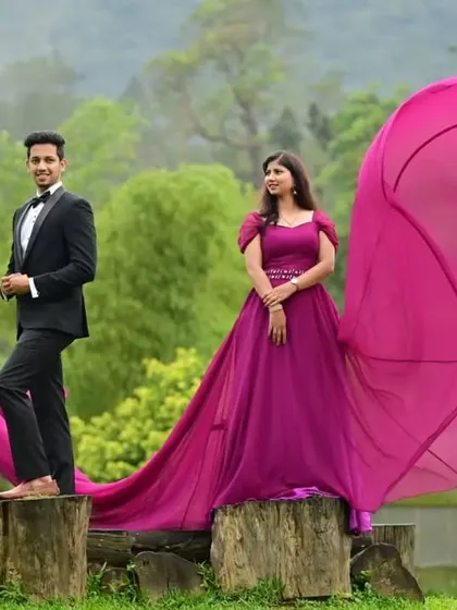 This shot shows the full splendor of the magenta trail gown. It's a fantastic rental option for couples who want to make a bold statement in their pre-wedding photos.