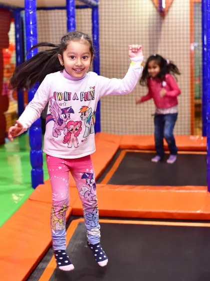 Jumping for joy on the trampoline. It's a fantastic way for kids to get active and improve their gross motor skills.