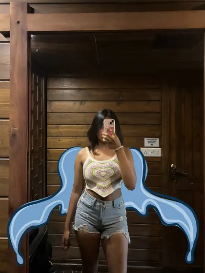 A mirror selfie with a cute heart-shaped top, with some blue water-like doodles for a cool effect.