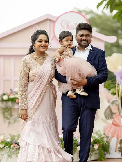 A happy family portrait at an elegant first birthday party.
