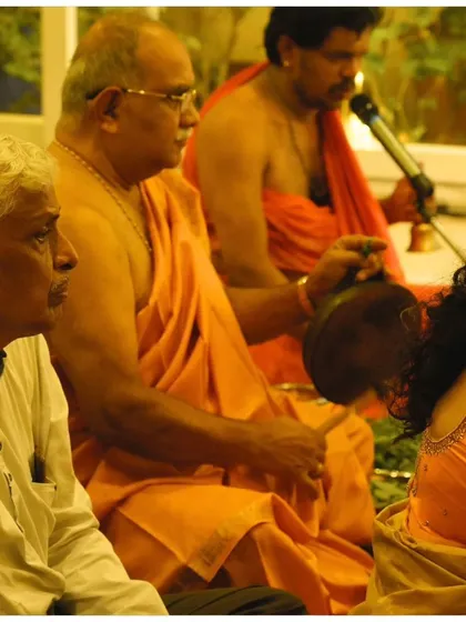 Priests and musicians leading the bhajans during our Janmashtami event. The combination of sacred chants and traditional instruments helps elevate the spirit and immerse everyone in the celebration of Krishna's birth.