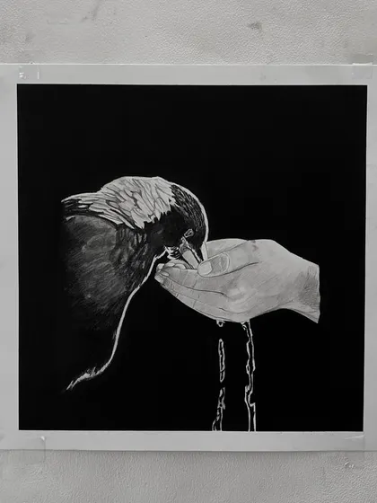 "Caring." This drawing of a bird drinking from a hand is about nurturing and kindness. The water trickling down was a fun detail to draw.
