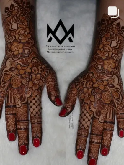 A beautiful and intricate design with red nails, perfect for a bride or a wedding guest.
