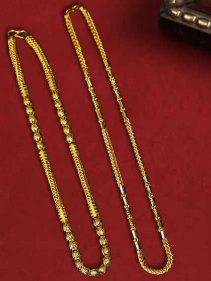A simple yet powerful flat lay of two different gold chain designs on a solid red background. This approach clearly displays product variety while maintaining a strong visual theme.