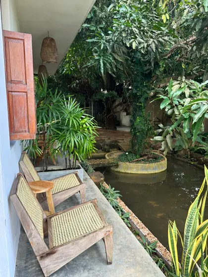The serene view from one of the rooms at our Sri Lanka retreat venue. The space is designed to blend seamlessly with nature, creating a peaceful sanctuary for rest.