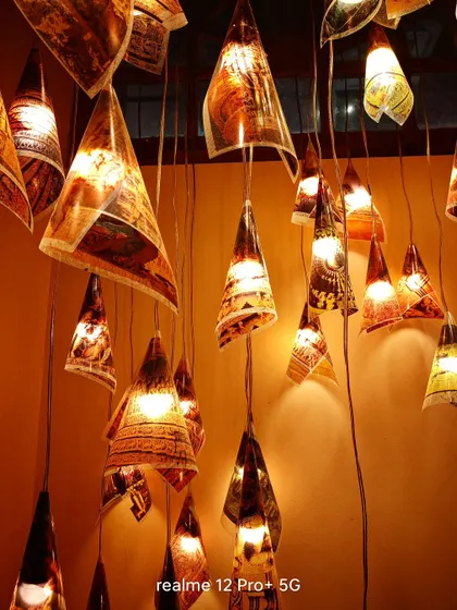 An atmospheric shot of hanging lanterns taken with the Realme 12 Pro+. This shows the phone's low-light camera performance and ability to capture ambiance.
