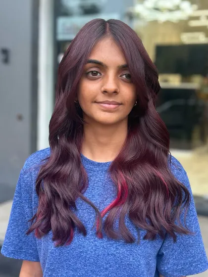 A front-facing view of the beautiful vine hair color. The shade is deep and luxurious, and the subtle pink highlight adds a pop of fun.