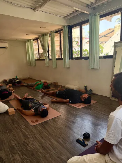 Guiding students into a deep Savasana, the final resting pose. After an active practice, this is where the body and mind integrate the benefits of the work we have done.