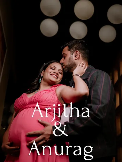 A warm and intimate couple's maternity portrait. The low-key lighting and close framing draw attention to the couple's happy expressions and loving embrace, making it a perfect shot for announcing their journey.