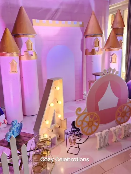 A magical Frozen castle setup for a 4th birthday. I created a 3D castle backdrop and a princess carriage to make the birthday girl feel like royalty.