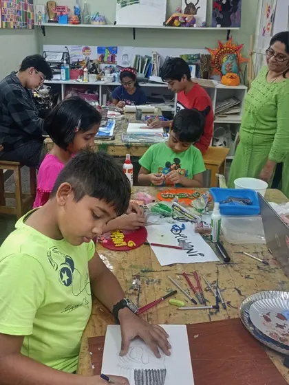 A full view of our bustling kids' class. I love providing a space where children can explore their creativity freely.