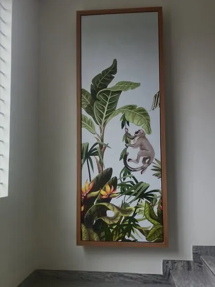 A tall, vertical wallpaper panel featuring a tropical scene with a monkey. This is a great way to add a decorative element to a narrow wall, like in a staircase landing.