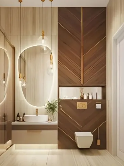 This luxurious bathroom features a stunning wood-panelled wall with gold inlay details. The backlit mirror and pendant lights enhance the opulent feel.