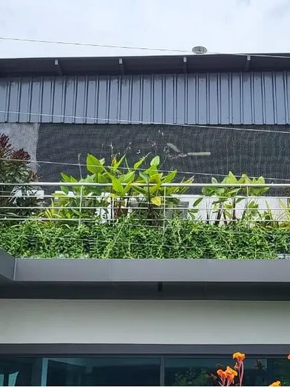 This is a duplicate of image 31. This image from our F Gear project shows how we can greenify multiple levels of a building. This upper-level balcony garden adds another layer of greenery, enhancing the building's aesthetic from every angle.